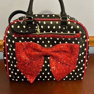Betsey Johnson handbag with attached wristlet.